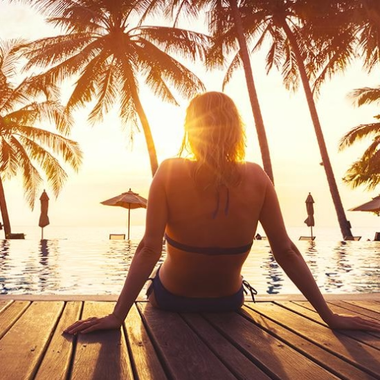 Woman lounging at the pool