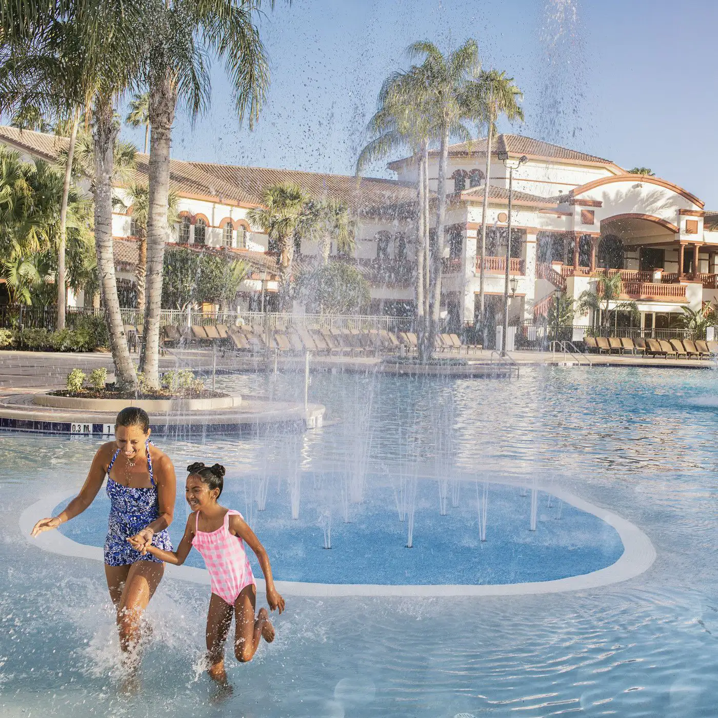 Mother and Daughter at the pool with fountain